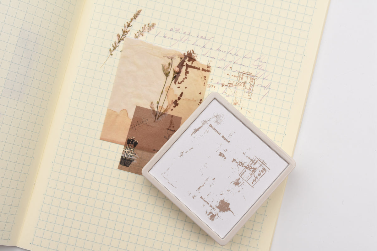 Scrapbook page decorated with stamps, photos, and stickers